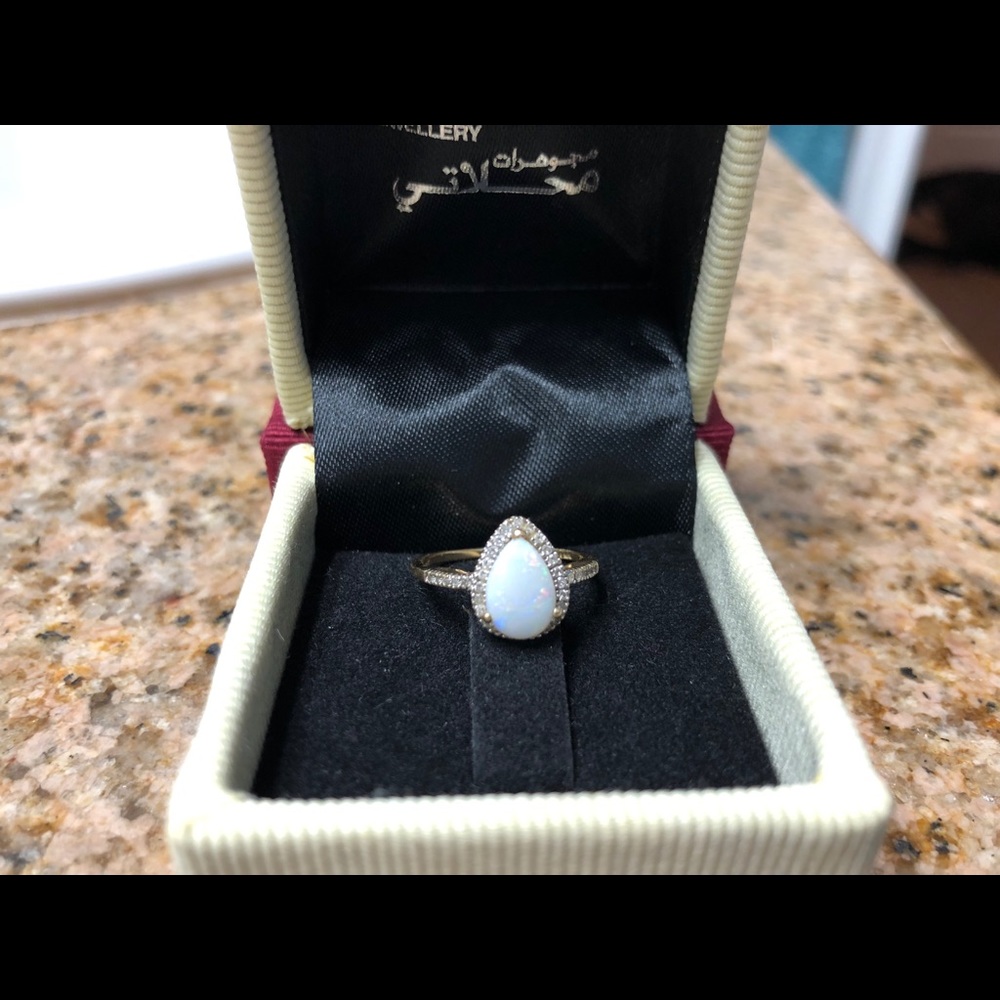 Opal ring, diamond halo with diamond band